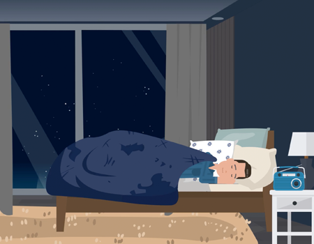 man trying to sleep next to his radio